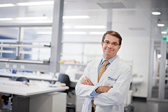 Professor Andrew Roberts standing in a lab