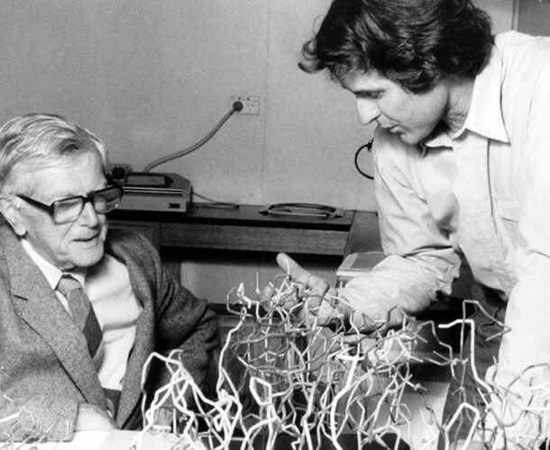 Peter Colman shows Macfarlane Burnet a structural model of the neuraminidase enzyme - black and white